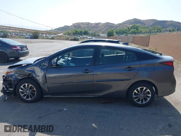 2021 Toyota Prius L Eco with VIN JTDKAMFU4M3144985, listed as a IAAI auction lot 42443957 with 20,816 mi miles and . Bid and sale history available at DreamBid. Image 14.
