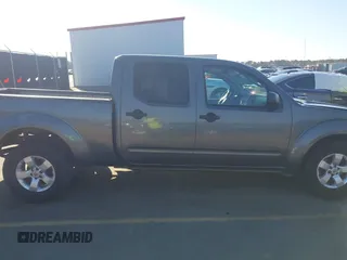 2009 Nissan Frontier LE with VIN 1N6AD09U79C402623, listed as a IAAI auction lot 41656385 with 286,777 mi miles and . Bid and sale history available at DreamBid. Image 13.