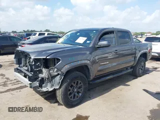 2021 Toyota Tacoma SR with VIN 3TYAX5GNXMT012484, listed as a IAAI auction lot 42429068 with 105,555 mi miles and . Bid and sale history available at DreamBid. Image 2.