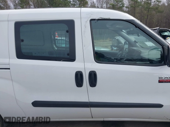 2019 Ram ProMaster City Cargo Tradesman z VIN ZFBHRFAB1K6M31770, wystawiony jako IAAI lot #41123546 z przebiegiem 75 517 mil mil oraz . Historia ofert i sprzedaży dostępna na DreamBid. Obrazek 13.