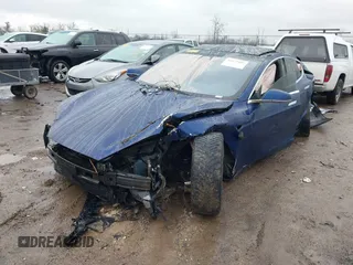 2016 Tesla Model S 90D with VIN 5YJSA1E44GF169960, listed as a IAAI auction lot 41523807 with 124,738 mi miles and . Bid and sale history available at DreamBid. Image 2.