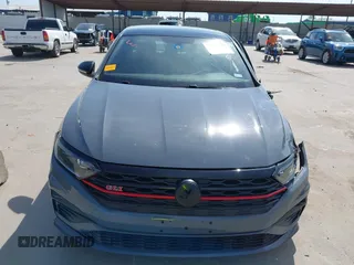 2020 Volkswagen Jetta GLI S z VIN 3VW6T7BU0LM047800, wystawiony jako IAAI lot #42263748 z przebiegiem 58 903 mil mil oraz . Historia ofert i sprzedaży dostępna na DreamBid. Obrazek 12.
