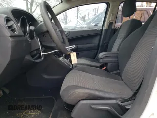 2011 Dodge Caliber Mainstreet with VIN 1B3CB3HA7BD298372, listed as a Copart auction lot 52785185 with 155,315 mi miles and Salvage Title. Bid and sale history available at carsss.com. Image 7.