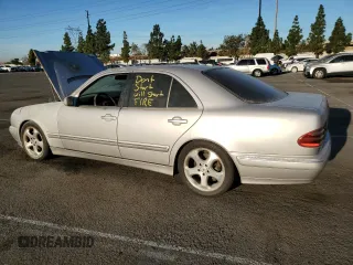 2002 Mercedes-Benz E-Class with VIN WDBJF65J32B496411, listed as a Copart auction lot 75690884 with 128,855 mi miles and Salvage Title. Bid and sale history available at carsss.com. Image 2.