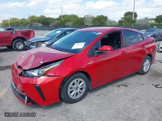 2021 Toyota Prius L Eco with VIN JTDKAMFU6M3148195, listed as a IAAI auction lot 41801369 with 130,601 mi miles. Bid and sale history available at carsss.com. Image 18.