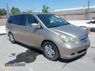 2005 Honda Odyssey EX-L with VIN 5FNRL387X5B082152, listed as a IAAI auction lot 42095459 with 202,445 mi miles. Bid and sale history available at carsss.com. Image 1.