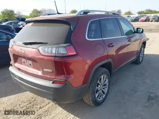 2019 Jeep Cherokee Altitude with VIN 1C4PJLLXXKD120325, listed as a IAAI auction lot 41838643 with 124,315 mi miles. Bid and sale history available at carsss.com. Image 4.
