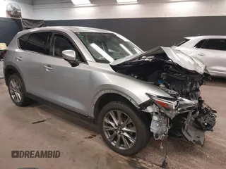 2021 Mazda CX-5 Grand Touring with VIN JM3KFBDM7M1392644, listed as a IAAI auction lot 41824612 with 80,000 mi miles and . Bid and sale history available at DreamBid. Image 1.