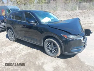 2020 Mazda CX-5 Touring z VIN JM3KFBCM5L0791591, wystawiony jako IAAI lot #41995028 z przebiegiem 33 696 mil mil oraz . Historia ofert i sprzedaży dostępna na DreamBid. Obrazek 1.