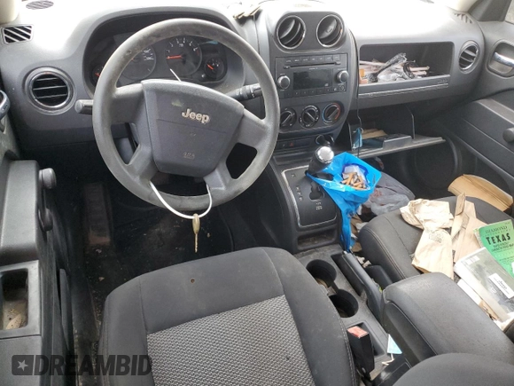 2009 Jeep Patriot Sport z VIN 1J4FT28A49D122175, wystawiony jako Copart lot #51518055 z przebiegiem 127 815 mil mil oraz Szkoda całkowita • Salvage title. Historia ofert i sprzedaży dostępna na DreamBid. Obrazek 8.