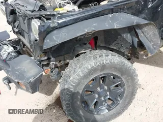 2014 Jeep Wrangler Sahara with VIN 1C4AJWBG9EL311477, listed as a IAAI auction lot 41884255 with 82,221 mi miles and . Bid and sale history available at carsss.com. Image 6.