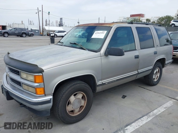 1999 Chevrolet Tahoe Z71 with VIN 1GNEK13R4XJ504675, listed as a IAAI auction lot 42162102 with 320,128 mi miles and . Bid and sale history available at DreamBid. Image 2.