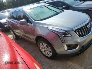2023 Cadillac XT5 FWD Luxury z VIN 1GYKNAR4XPZ144533, wystawiony jako Copart lot #74734164 z przebiegiem Nie podano mil oraz Nie do naprawy • Non repairable. Historia ofert i sprzedaży dostępna na DreamBid. Obrazek 4.