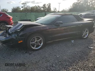 1999 Pontiac Firebird Trans Am with VIN 2G2FV32G1X2217352, listed as a Copart auction lot 79941714 with 174,580 mi miles and Salvage title. Bid and sale history available at DreamBid. Image 1.
