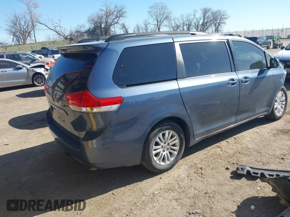 2014 Toyota Sienna XLE with VIN 5TDYK3DC2ES500586, listed as a IAAI auction lot 41995867 with 148,861 mi miles and . Bid and sale history available at DreamBid. Image 4.