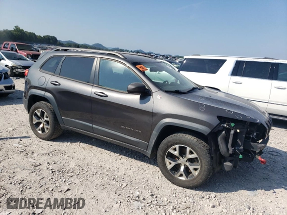 2014 Jeep Cherokee Trailhawk with VIN 1C4PJMBS1EW304718, listed as a Copart auction lot 64105485 with 151,315 mi miles and Salvage title. Bid and sale history available at DreamBid. Image 4.