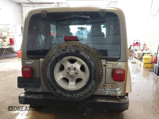 2003 Jeep Wrangler Sahara z VIN 1J4FA59S83P343234, wystawiony jako IAAI lot #41644074 z przebiegiem 197 461 mil mil oraz . Historia ofert i sprzedaży dostępna na DreamBid. Obrazek 16.