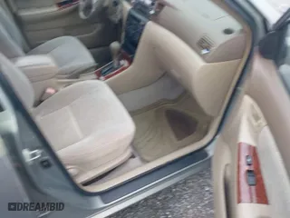 2004 Toyota Corolla CE with VIN 2T1BR32E24C309957, listed as a IAAI auction lot 41894304 with 299,999 mi miles. Bid and sale history available at carsss.com. Image 5.