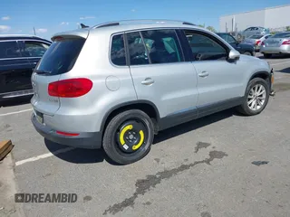 2015 Volkswagen Tiguan SE with VIN WVGAV7AX0FW544218, listed as a IAAI auction lot 41897418 with 97,235 mi miles and . Bid and sale history available at DreamBid. Image 4.