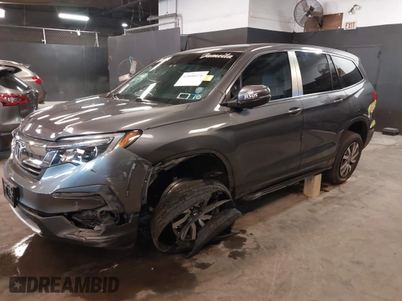 2022 Honda Pilot EX-L with VIN 5FNYF6H59NB000754, listed as a IAAI auction lot 42090576 with 32,813 mi miles and . Bid and sale history available at DreamBid. Image 6.