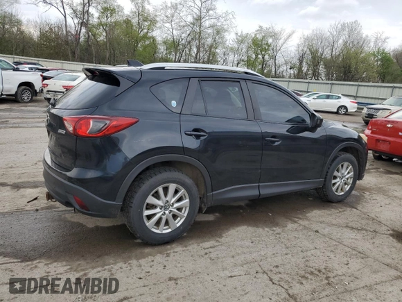 2014 Mazda CX-5 Touring with VIN JM3KE2CY8E0424757, listed as a Copart auction lot 54703195 with 111,401 mi miles and Salvage Title. Bid and sale history available at DreamBid. Image 3.
