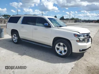 2015 Chevrolet Suburban LTZ with VIN 1GNSKKKC0FR130023, listed as a Copart auction lot 46630825 with 140,057 mi miles and Salvage Title. Bid and sale history available at carsss.com. Image 4.