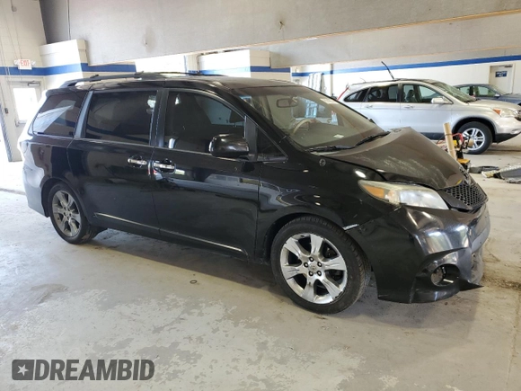 2014 Toyota Sienna SE with VIN 5TDXK3DC5ES418508, listed as a Copart auction lot 69742974 with 210,168 mi miles and Salvage Title. Bid and sale history available at DreamBid. Image 4.