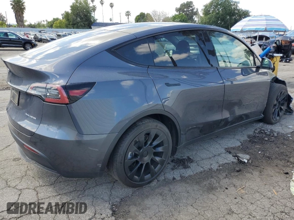 2023 Tesla Model Y Long Range z VIN 7SAYGAEE7PF714828, wystawiony jako Copart lot #89210485 z przebiegiem 42 256 mil mil oraz Szkoda całkowita • Salvage title. Historia ofert i sprzedaży dostępna na DreamBid. Obrazek 3.