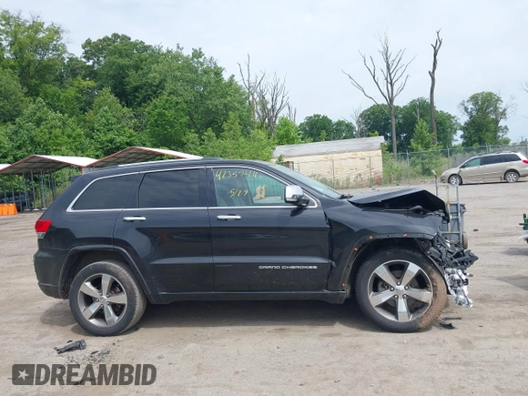 2015 Jeep Grand Cherokee Overland z VIN 1C4RJFCG3FC753772, wystawiony jako IAAI lot #42357411 z przebiegiem 130 970 mil mil oraz . Historia ofert i sprzedaży dostępna na DreamBid. Obrazek 13.