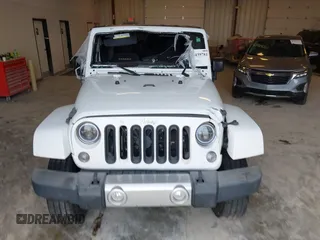 2015 Jeep Wrangler Sahara with VIN 1C4AJWBG7FL648621, listed as a IAAI auction lot 42439781 with 107,148 mi miles and . Bid and sale history available at DreamBid. Image 12.