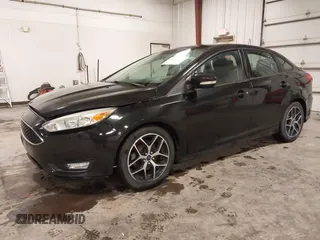 2015 Ford Focus SE with VIN 1FADP3F24FL255450, listed as a IAAI auction lot 41673301 with 103,650 mi miles. Bid and sale history available at carsss.com. Image 2.