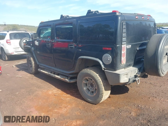 2003 Hummer H2 with VIN 5GRGN23U33H144379, listed as a IAAI auction lot 41452982 with 227,746 mi miles. Bid and sale history available at carsss.com. Image 3.