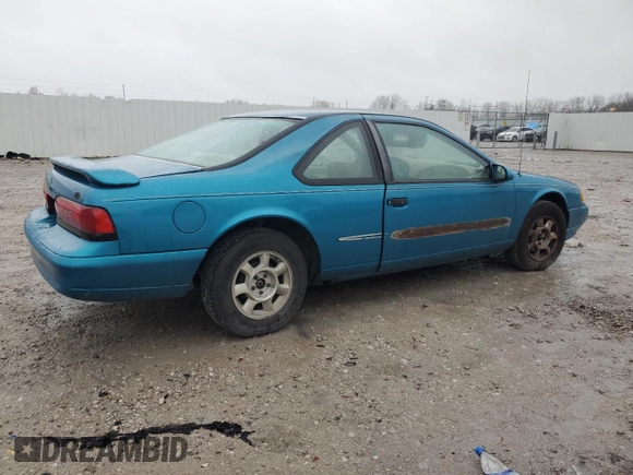 1994 Ford Thunderbird LX with VIN 1FALP6243RH223519, listed as a Copart auction lot 80962814 with 125,016 mi miles and Salvage Title. Bid and sale history available at DreamBid. Image 3.