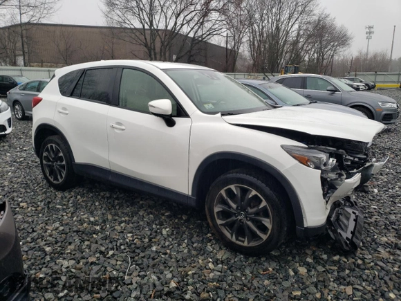2016 Mazda CX-5 Grand Touring with VIN JM3KE4DY8G0728765, listed as a Copart auction lot 51625825 with 141,681 mi miles and Salvage Title. Bid and sale history available at carsss.com. Image 4.