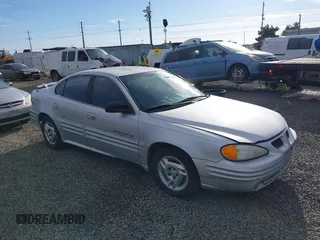 2001 Pontiac Grand Am SE1 with VIN 1G2NF52TX1M560650, listed as a IAAI auction lot 41654339 with 122,885 mi miles. Bid and sale history available at carsss.com. Image 1.