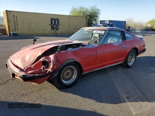 1983 Datsun 280ZX z VIN JN1HZ04S0DX569855, wystawiony jako Copart lot #74027594 z przebiegiem 12 300 mil mil oraz Szkody całkowita. Historia ofert i sprzedaży dostępna na DreamBid. Obrazek 1.