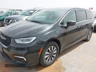 2023 Chrysler Pacifica Hybrid Touring L с VIN 2C4RC1L78PR551371, выставлен на аукционе IAAI как лот 42235410 с пробегом 49 519 миль миль и . История ставок и продаж доступна на DreamBid. Изображение 2.