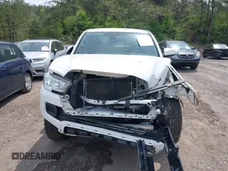 2021 Toyota Tacoma 4WD SR with VIN 3TMCZ5AN2MM414975, listed as a IAAI auction lot 41997227 with 57,729 mi miles. Bid and sale history available at carsss.com. Image 6.