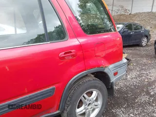 2001 Honda CR-V EX z VIN JHLRD18611C045140, wystawiony jako IAAI lot #42253482 z przebiegiem 142 237 mil mil oraz . Historia ofert i sprzedaży dostępna na DreamBid. Obrazek 15.