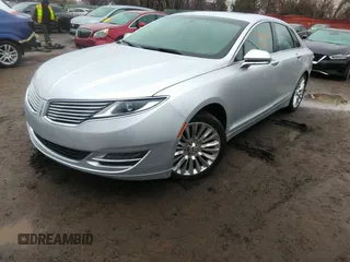 2013 Lincoln MKZ with VIN 3LN6L2JKXDR811822, listed as a IAAI auction lot 42009690 with 128,405 mi miles. Bid and sale history available at carsss.com. Image 2.
