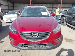 2016 Mazda CX-5 Grand Touring with VIN JM3KE4DY0G0709563, listed as a IAAI auction lot 41886956 with 156,769 mi miles. Bid and sale history available at carsss.com. Image 13.
