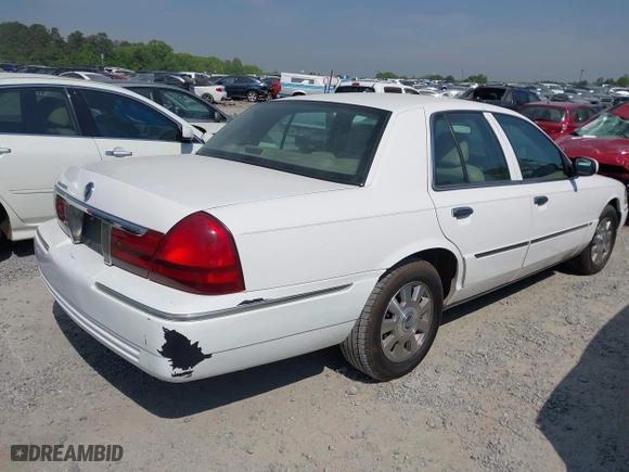 2003 Mercury Grand Marquis LS Premium with VIN 2MEFM75W33X669341, listed as a IAAI auction lot 42063018 with 124,047 mi miles. Bid and sale history available at carsss.com. Image 4.