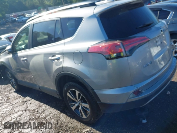 2018 Toyota RAV4 XLE with VIN 2T3WFREV6JW442859, listed as a IAAI auction lot 42252071 with 67,749 mi miles and . Bid and sale history available at DreamBid. Image 3.