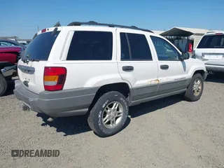 2002 Jeep Grand Cherokee Laredo with VIN 1J4GW48SX2C247709, listed as a IAAI auction lot 42444030 with 196,591 mi miles and . Bid and sale history available at DreamBid. Image 4.