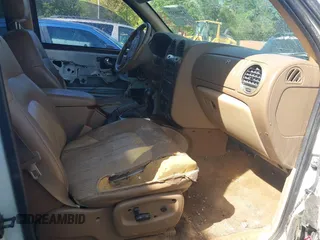 2003 GMC Envoy SLT with VIN 1GKDT13S432190085, listed as a IAAI auction lot 42106915 with 289,933 mi miles. Bid and sale history available at carsss.com. Image 5.