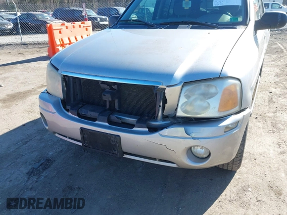 2004 GMC Envoy SLE with VIN 1GKDT13S642213710, listed as a IAAI auction lot 41680656 with 239,187 mi miles. Bid and sale history available at carsss.com. Image 6.
