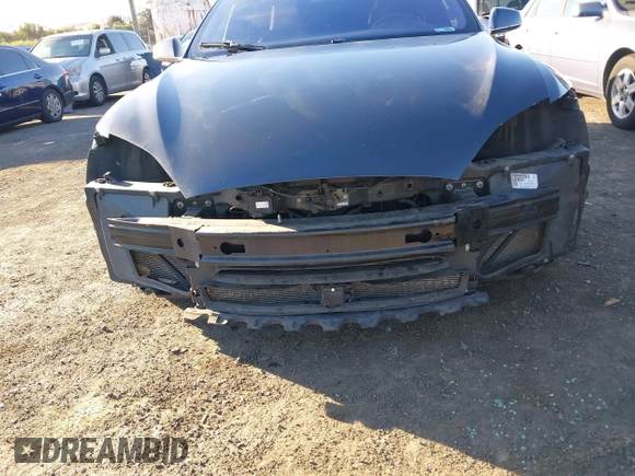 2015 Tesla Model S 85D with VIN 5YJSA1E28FF110066, listed as a IAAI auction lot 40672973 with 100,157 mi miles. Bid and sale history available at carsss.com. Image 6.