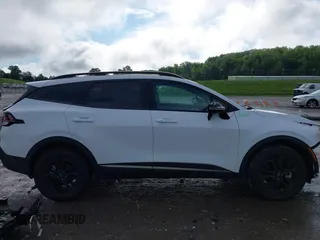 2023 Kia Sportage X-Pro Prestige z VIN 5XYK7CAF6PG135612, wystawiony jako IAAI lot #42244280 z przebiegiem 7 084 mil mil oraz . Historia ofert i sprzedaży dostępna na DreamBid. Obrazek 14.