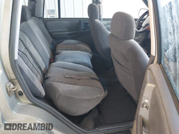1998 Jeep Grand Cherokee Laredo with VIN 1J4GZ48S4WC262249, listed as a IAAI auction lot 42739473 with 94,094 mi miles and . Bid and sale history available at DreamBid. Image 8.