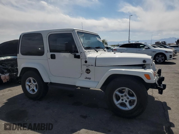 2000 Jeep Wrangler Sahara with VIN 1J4FA59S6YP790541, listed as a Copart auction lot 53837885 with 137,827 mi miles and Salvage title. Bid and sale history available at DreamBid. Image 4.